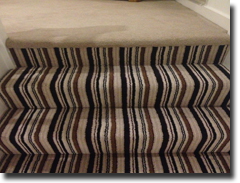 Vogue twist pile stripe carpet and matching plain on landing